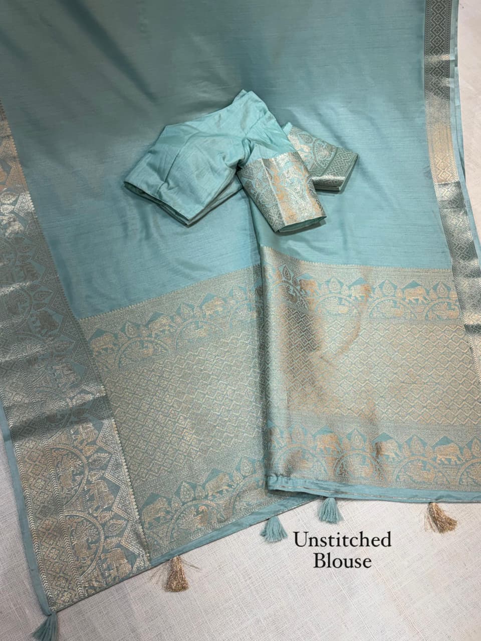 A classy light weight  pastal colors saree with touch of zari weaving jacquard