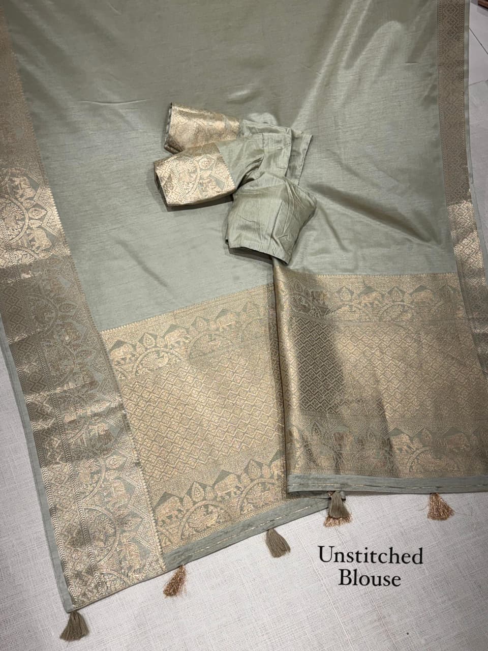 A classy light weight  pastal colors saree with touch of zari weaving jacquard