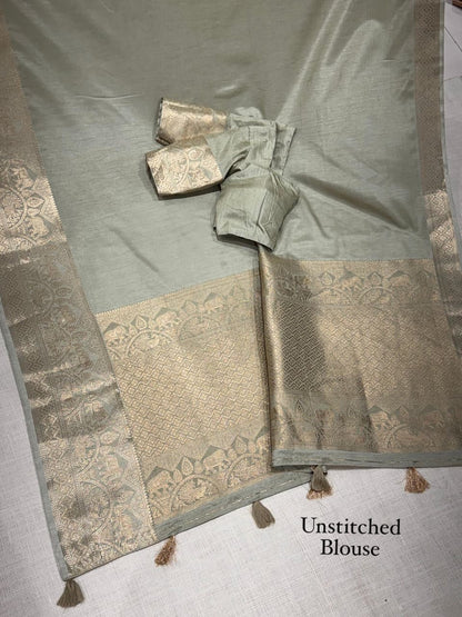 A classy light weight  pastal colors saree with touch of zari weaving jacquard